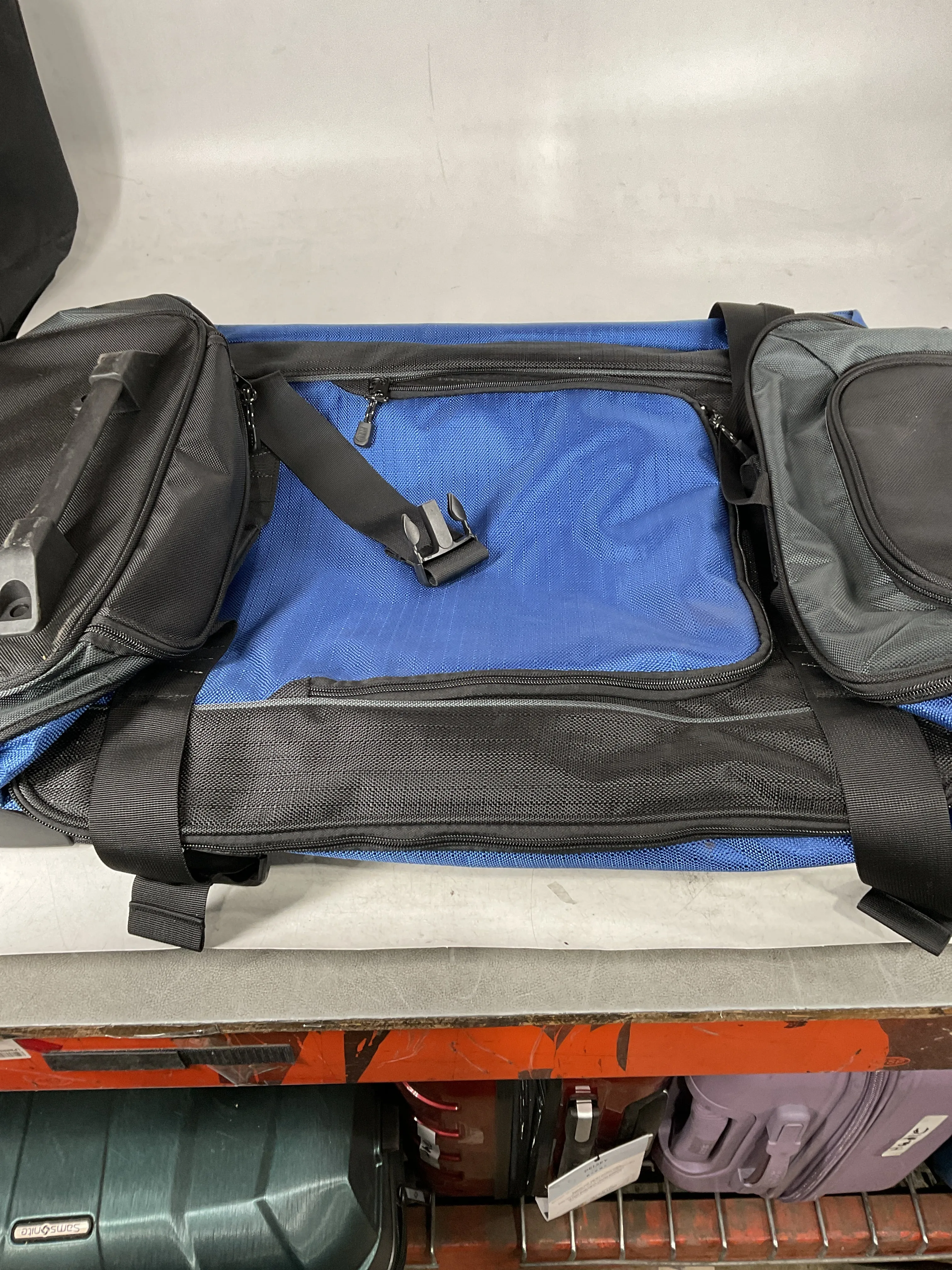 Amazon Basics Rolling Duffel Bag with Wheels, Ripstop Luggage for Traveling, Telescoping Handle, 35", Blue Blue 35" U1